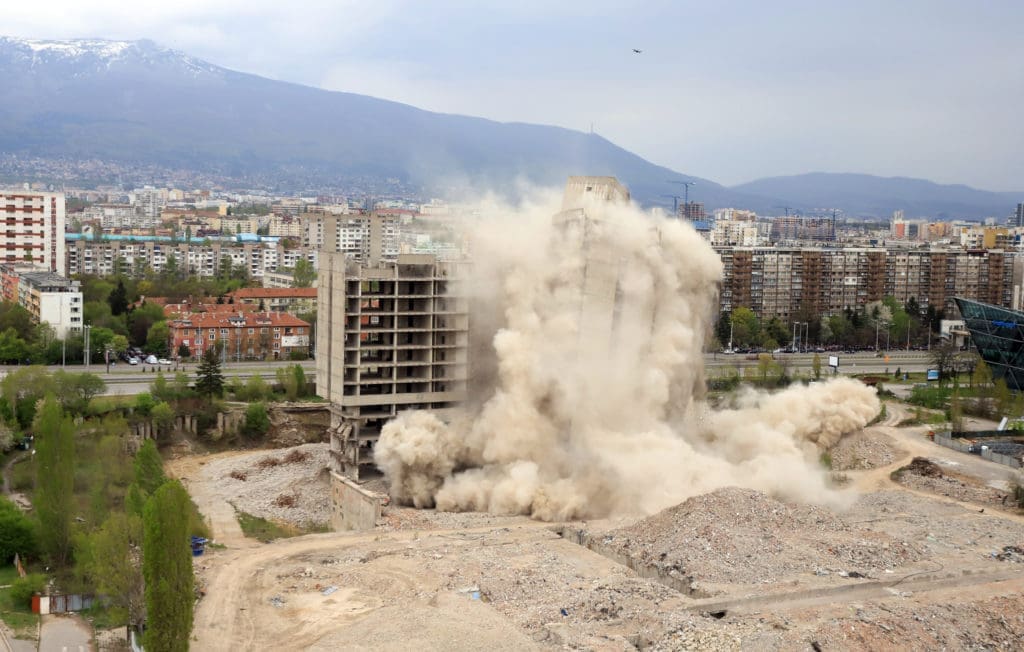 Controlled explosion with blasts of a unfinished and abandoned empty high building, printing press house IPK Rodina, in Sofia, Bulgaria on 04/26/2020.